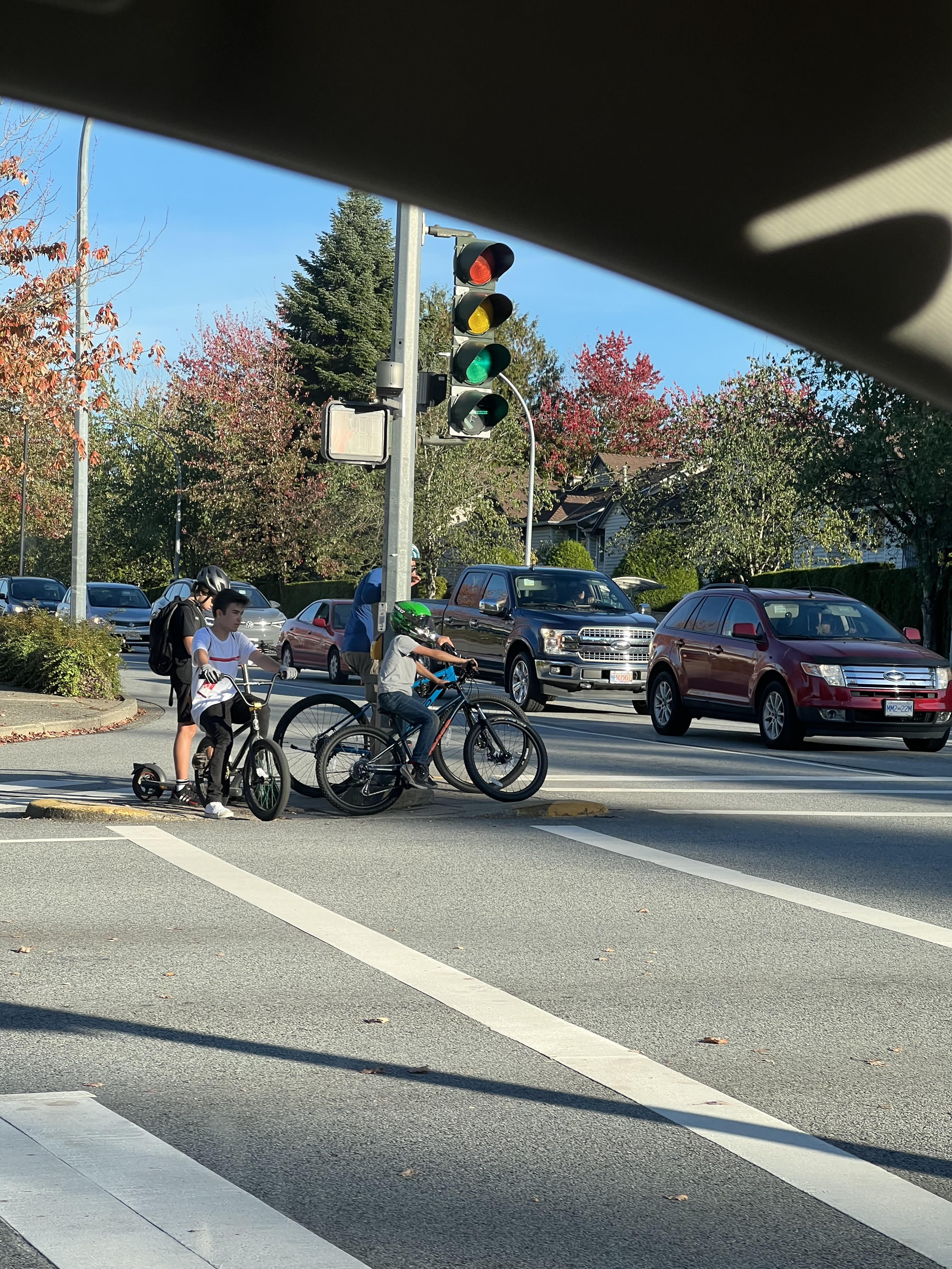 Crowded pedestrian island at Walnut Grove Drive and 88 Ave intersection