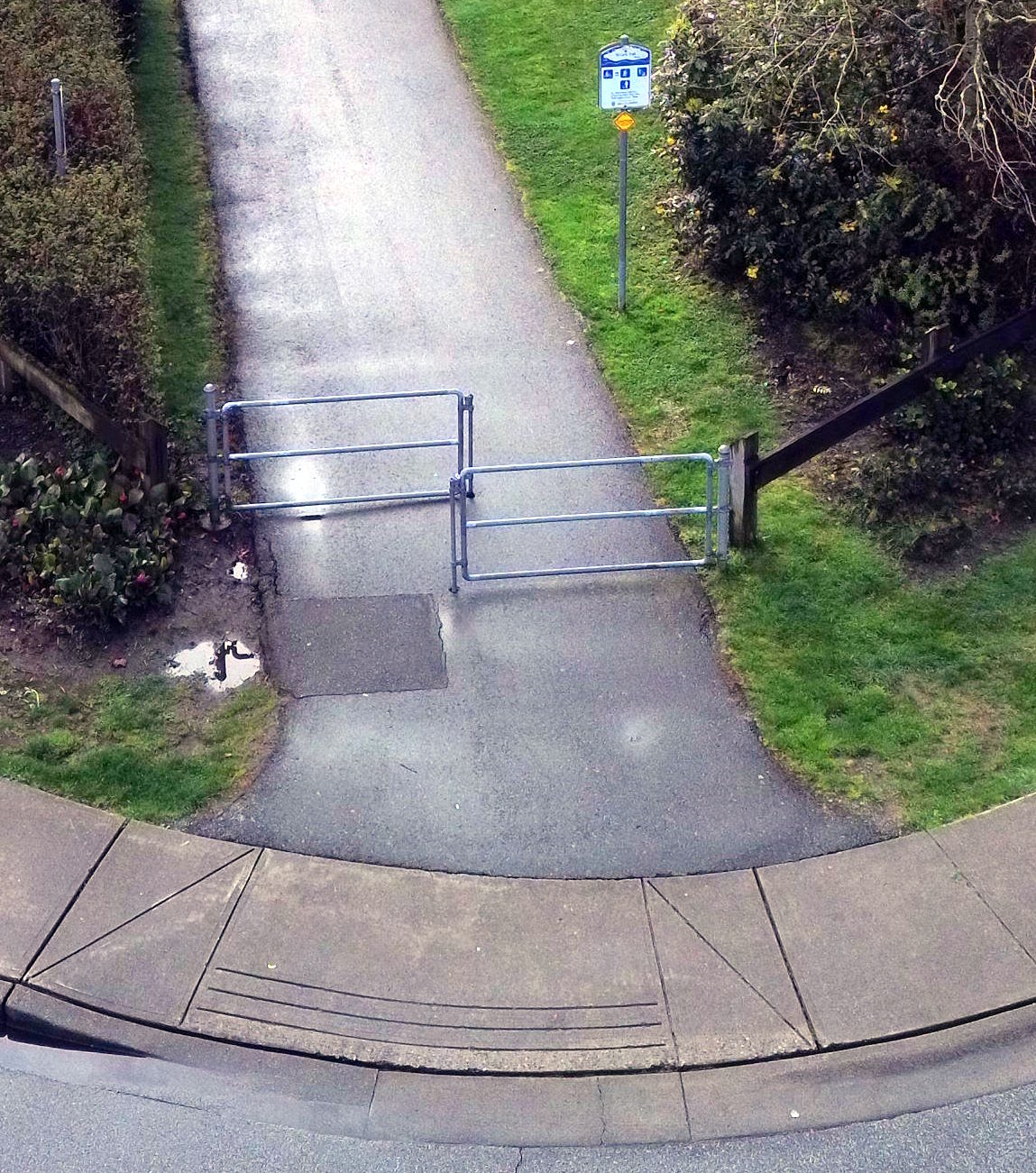 Maze gate restricting trail access showing the narrow opening
