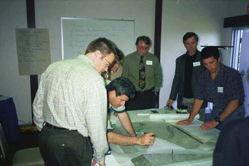 Design team reviewing plans and sketches
