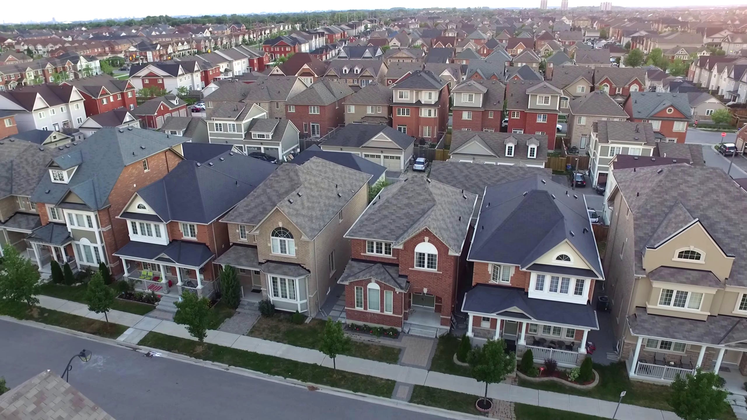 Dense neighbourhood with three-story homes and coach houses